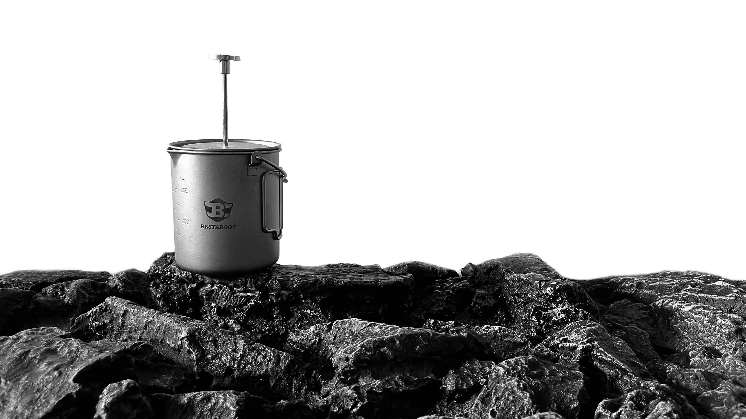 Bestargot Titanium French Press is placed on the rock