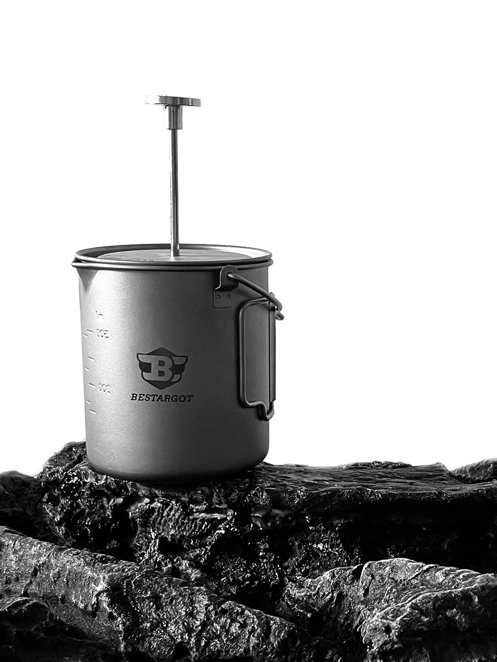 Bestargot Titanium French Press is placed on the rock